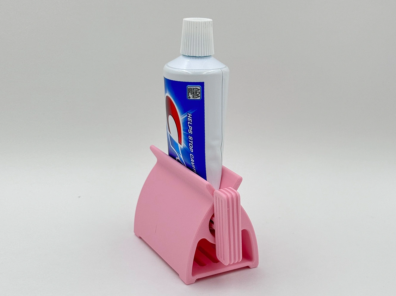 Držač paste za zube i istiskivač